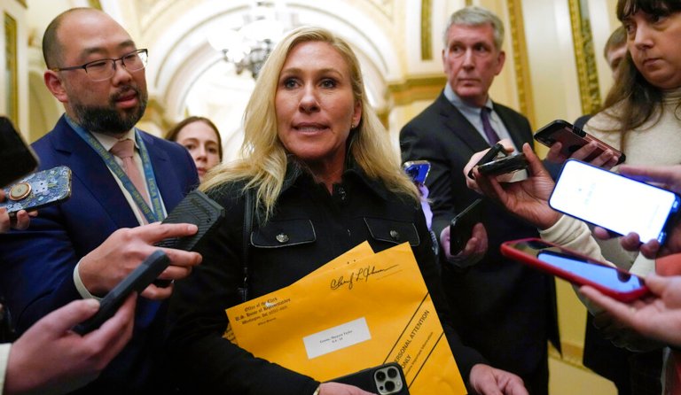 Rep. Marjorie Taylor Greene, R-Ga., talks with reporters on Capitol Hill in Washington, Tuesday, Jan. 3, 2023, after the House adjourned following the third failed attempt to elect a Speaker of the House for the 118th Congress.