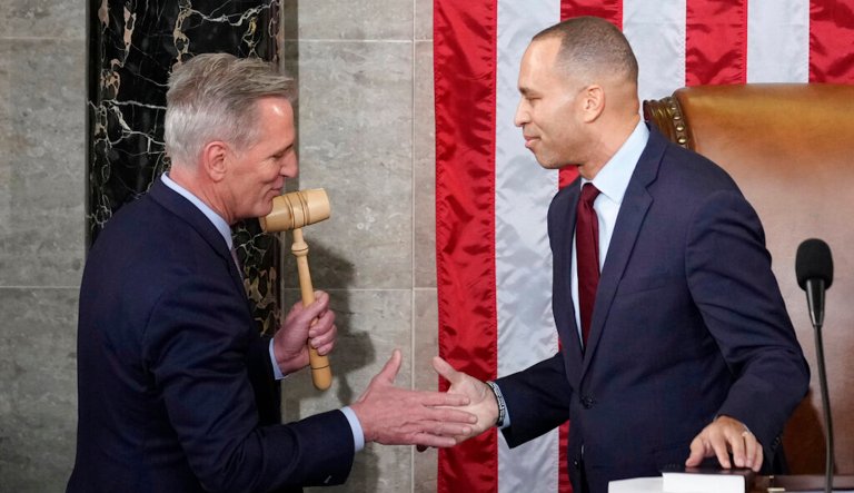 Incoming House Speaker Kevin McCarthy of California receives the gavel from House Minority Leader Hakeem Jeffries of New York on the House floor at the U.S. Capitol in Washington, early Saturday, Jan. 7, 2023. 