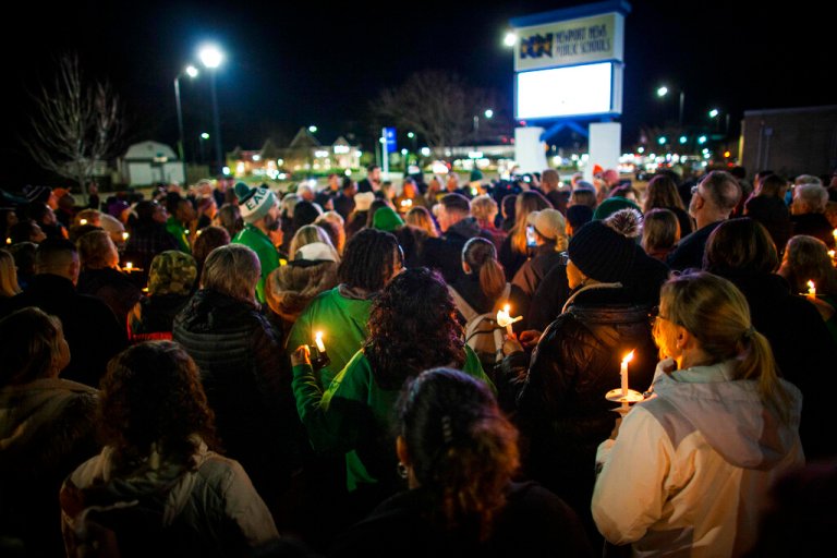 Residents of Newport News hold a candlelight vigil in honor of Richneck Elementary School first-grade teacher Abby Zwerner at the School Administration Building in Newport News, Virginia., Monday, Jan. 9, 2023. 