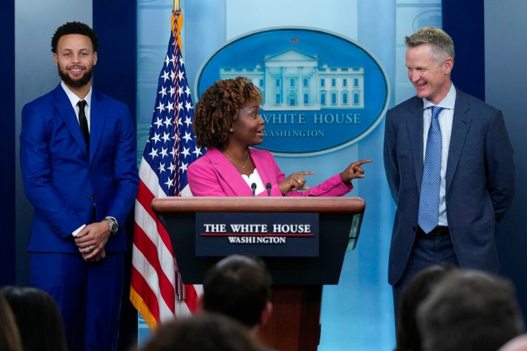 White House press secretary Karine Jean-Pierre (center), joined by Golden State Warriors Head Coach Steve Kerr (right) and Stephen Curry (left), speaks during the daily briefing at the White House in Washington, Tuesday, Jan. 17, 2023.