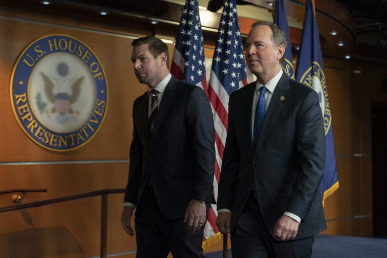 Reps. Adam Schiff, D-Calif., right, and Eric Swalwell, D-Calif., leave a news conference with Rep. Ilhan Omar, D-Minn., on Capitol Hill in Washington, Wednesday, Jan. 25, 2023, in Washington.
