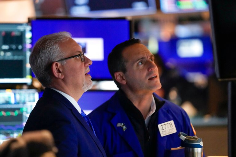 Traders work on the floor at the New York Stock Exchange in New York, Wednesday, Feb. 1, 2023. 