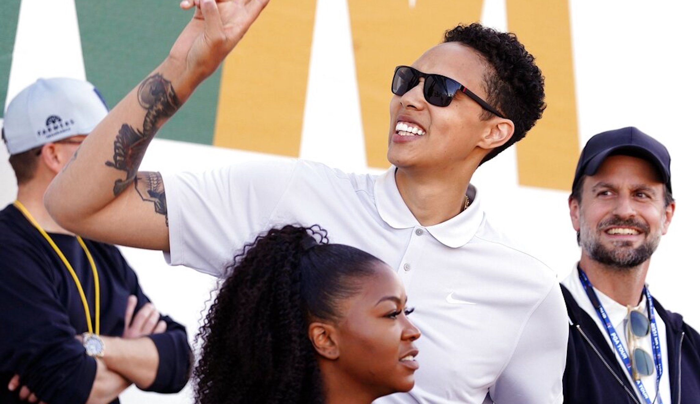 Brittney Griner waves to fans as she watches on the 16th hole during the third round of the Phoenix Open golf tournament, Saturday, Feb. 11, 2023, in Scottsdale, Ariz. (AP Photo/Darryl Webb)