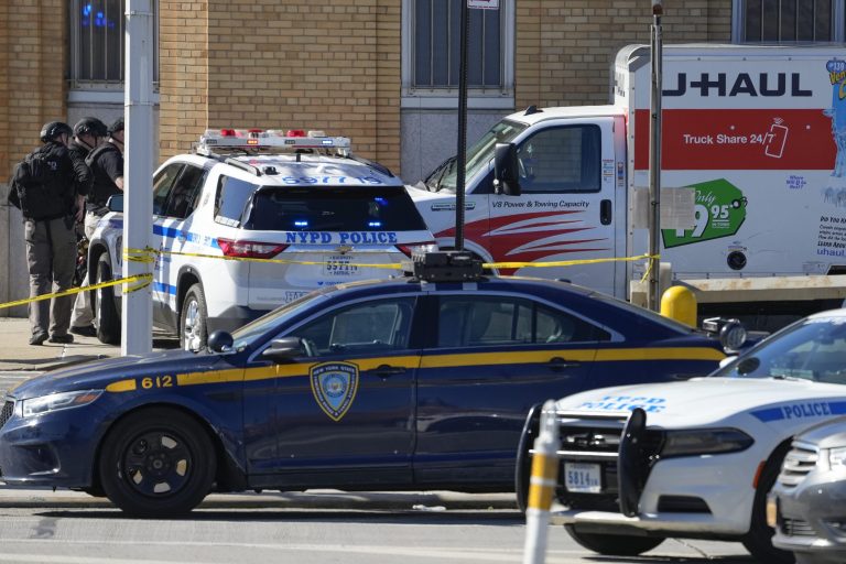 Members of the NYPD bomb squad pause before approaching a rental truck that was stopped and the driver arrested, Monday, Feb. 13, 2023, in New York. Police stopped a U-Haul truck and detained the driver after reports that the vehicle struck multiple pedestrians in New York City on Monday.