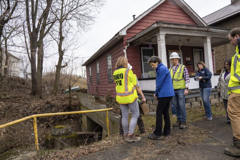 Ohio EPA officials, including director Anne Vogel, left, took a tour of the damage in East Palestine, Ohio on Thursday, Feb. 16, 2023. Residents of the Ohio village upended by a freight train derailment are demanding to know if they're safe from the toxic chemicals that spilled or were burned off to avoid an even bigger disaster. 
