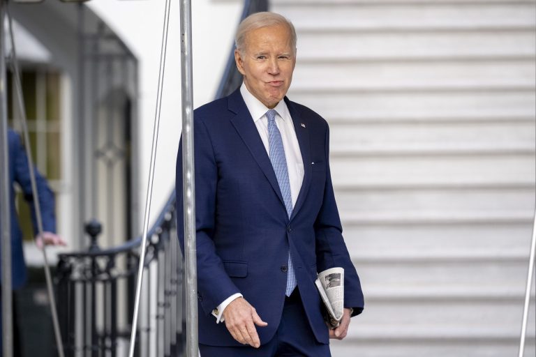 President Joe Biden walks towards members of the media before boarding Marine One on the South Lawn of the White House in Washington, Friday, Feb. 24, 2023, for travel to Wilmington, Del. 
