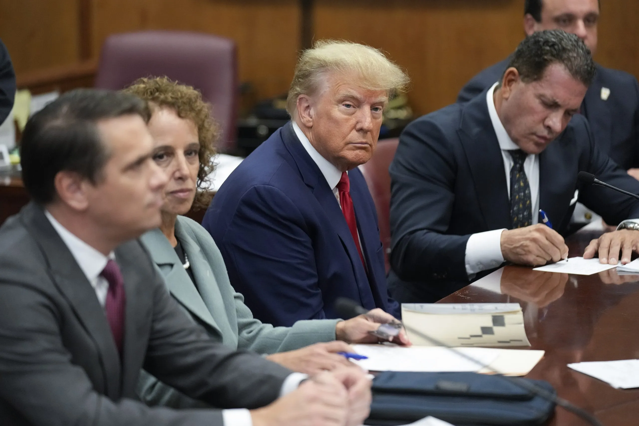 SEE IT: The extraordinary moment Trump surrenders himself to authorities