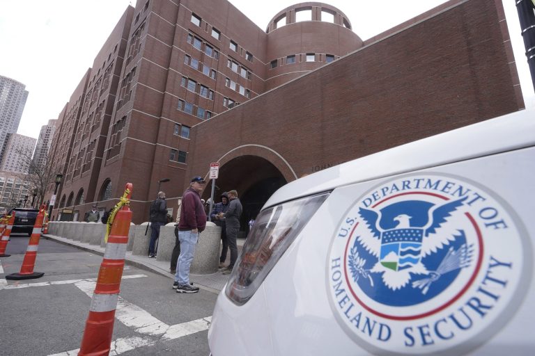 A Homeland Security vehicle, right, is parked outside the Moakley Federal Courthouse, Wednesday, April 19, 2023, in Boston. Jack Teixeira, the Massachusetts Air National Guardsman charged with leaking highly classified military documents, made a brief appearance in federal court Wednesday, but a hearing to determine whether he should remain jailed while awaiting trial has been delayed to give the defense more time to prepare.