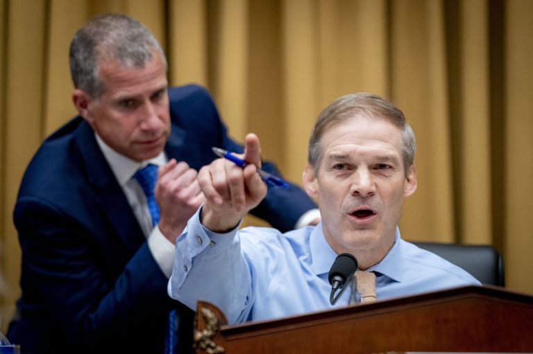 Republican staff attorney Steve Castor, left, whispers to Chairman Rep. Jim Jordan, R-Ohio, as he speaks during a House Judiciary subcommittee hearing on what Republicans say is the politicization of the FBI and Justice Department and attacks on American civil liberties, on Capitol Hill in Washington, Thursday, May 18, 2023. 