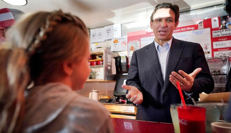 Florida Gov. Ron DeSantis speaks with patrons at the Red Arrow Diner during a visit to Manchester, N.H., Friday, May 19, 2023.