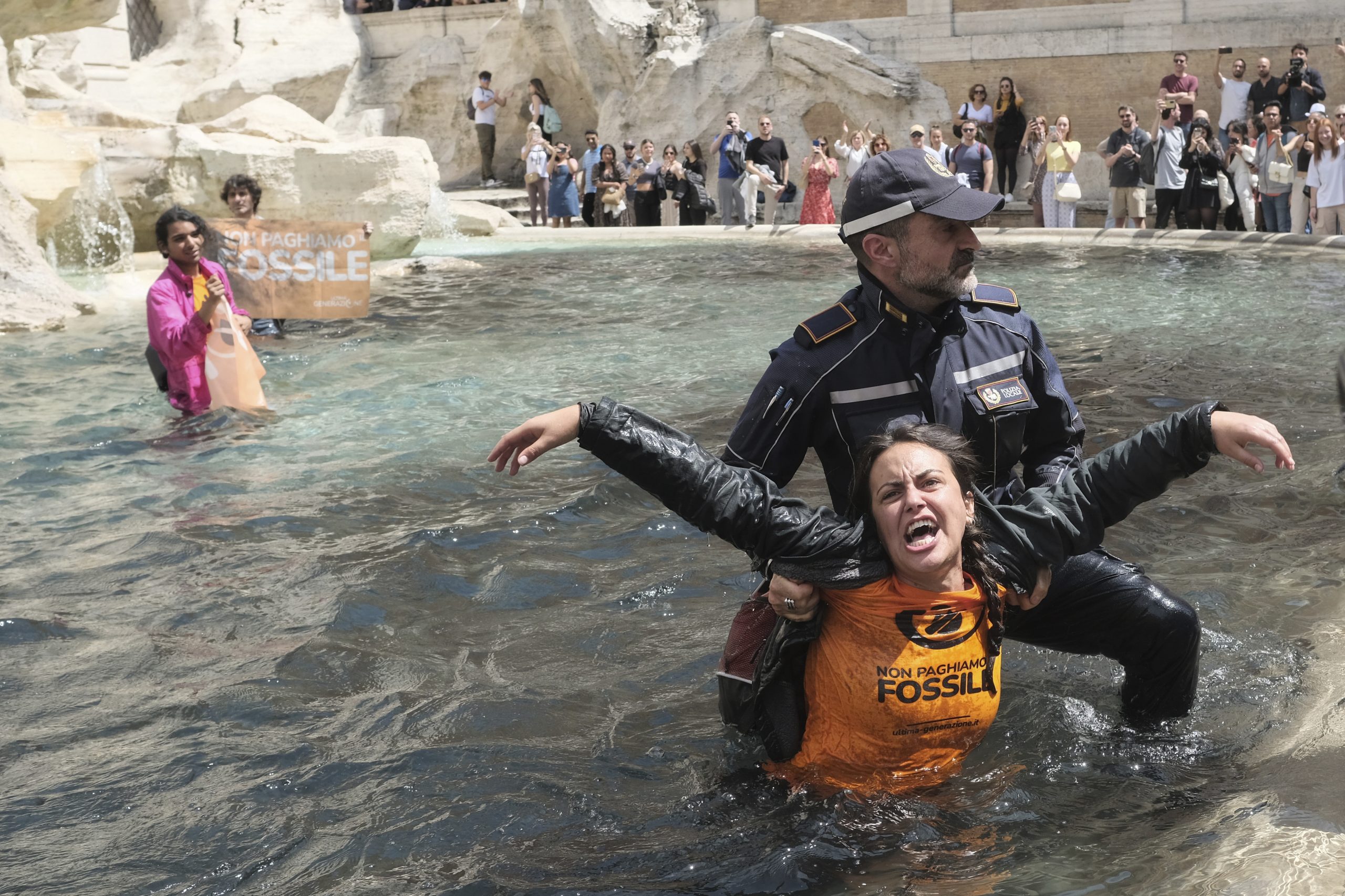 Climate protesters dye Rome’s iconic Trevi Fountain black
