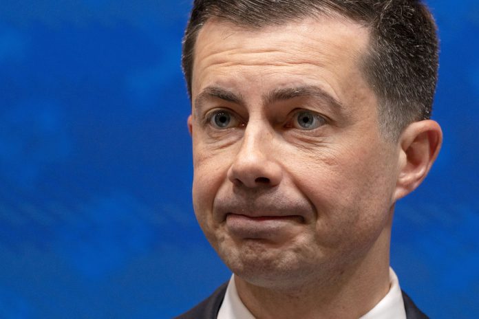 Transportation Secretary Pete Buttigieg speaks about summer airline travel ahead of Memorial Day Weekend, Tuesday, May 23, 2023, at the Department of Transportation in Washington. 