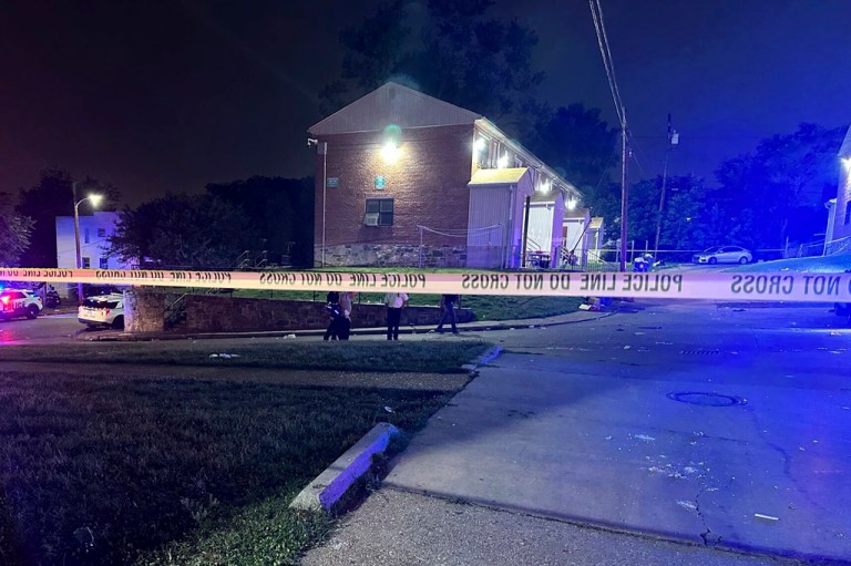 In this photo released by the Baltimore Police Department, police tape cordons off the area of a mass shooting incident in the Southern District of Baltimore, Maryland, early Sunday, July 2, 2023. 