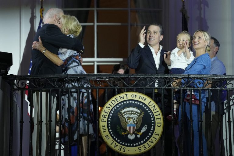 President Joe Biden and first lady Jill Biden, left, hug as Hunter Biden, his son Beau Biden and wife, Melissa Cohen, watch a fireworks show during a Fourth of July celebration at the White House in Washington, Tuesday, July 4, 2023.