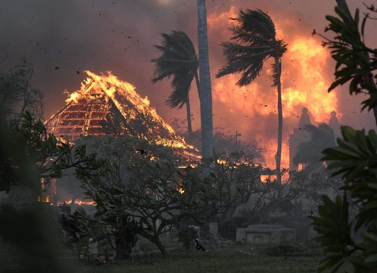 The hall of historic Waiola Church in Lahaina and nearby Lahaina Hongwanji Mission are engulfed in flames along Wainee Street on Tuesday, Aug. 8, 2023, in Lahaina, Hawaii. 