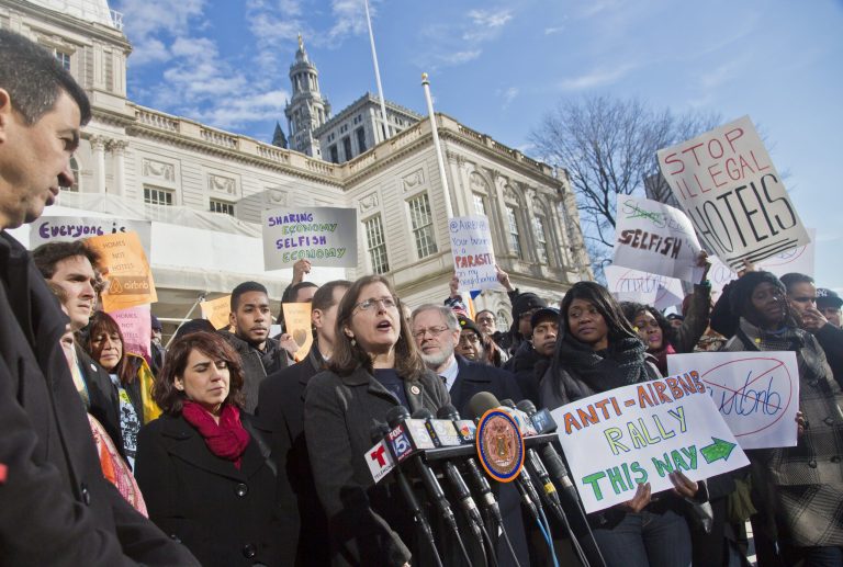 City Councilwoman Helen Rosenthal, center, joins opponents of Airbnb at a rally outside City Hall, Tuesday, Jan. 20, 2015, in New York. (AP Photo/Bebeto Matthews)