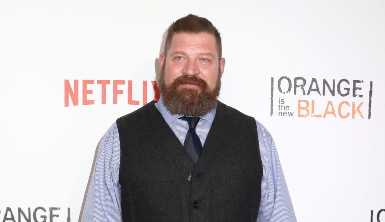 Brad William Henke is shown attending a premiere event celebrating season four of Netflix's 