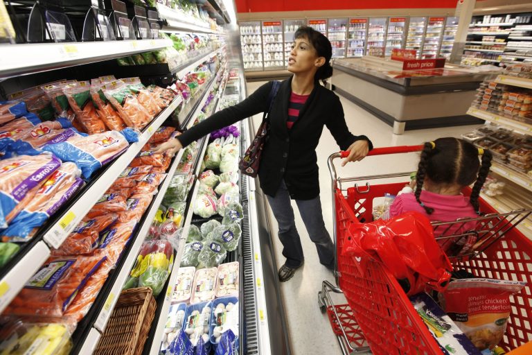 FILE - In this Oct. 15, 2009 file photo, Kolleen Irwin and her daughter Ariel, 3, shop for groceries at a Target store in Philadelphia. The Labor Department reports on U.S. producer prices in March later Friday April 11, 2014. (AP Photo/Matt Rourke, File)