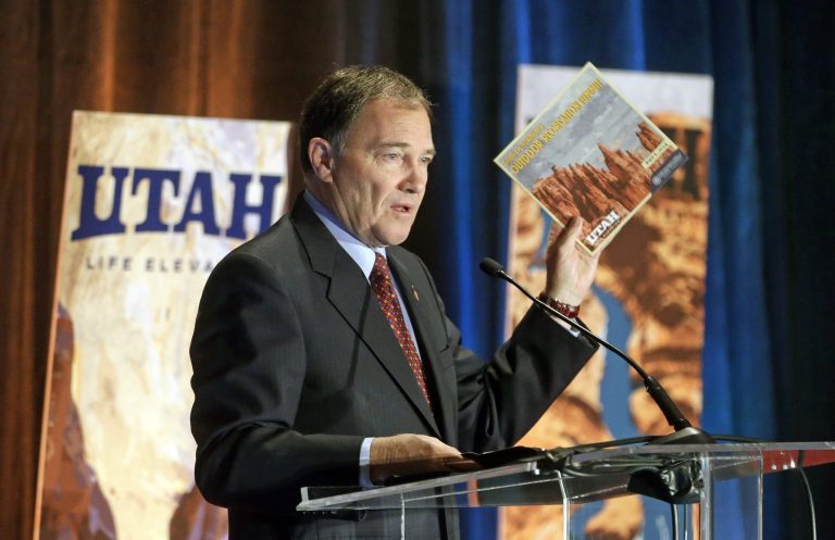 Utah Gov. Gary Herbert addresses the annual Outdoor Recreation Summit Thursday, May 8, 2014, in Salt Lake City. Gov. Herbert has kicked off his first annual Outdoor Recreation Summit by signing a long-awaited swap of state and federal lands in Grand, San Juan and Uintah Counties. The day's agenda includes discussions about public lands policy, business, recreation and tourism. (AP Photo/Rick Bowmer)