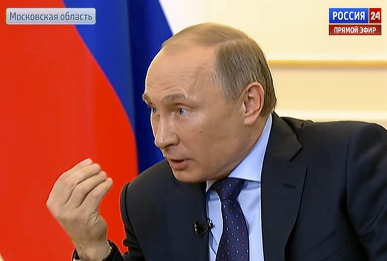 In this frame grab provided by the Russian Television via the APTN,  President Vladimir Putin, during a live feed, answers journalists' questions on the current situation around Ukraine at the Novo-Ogaryovo presidential residence outside Moscow, on Tuesday, March 4, 2014. (AP Photo/Russian Television via APTN)