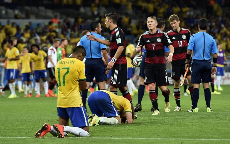 Brazil players sink to their knees after the World Cup semifinal soccer match between Brazil and Germany at the Mineirao Stadium in Belo Horizonte, Brazil, Tuesday, July 8, 2014. Germany won the match 7-1. (AP Photo/Martin Meissner)