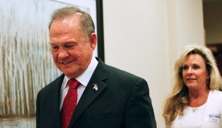 There are apparent contradictions between Republican Alabama Senate candidate Roy Moore's account of his relationship with his wife Kayla and information contained in public records. (AP Photo/Brynn Anderson)