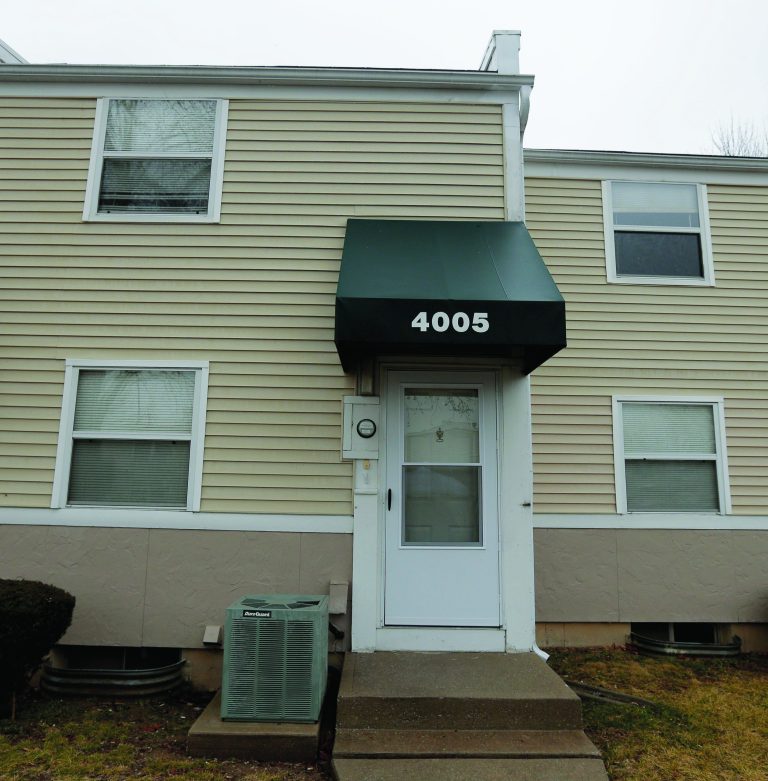 A townhouse where police found a 17-year-old boy handcuffed to a post in the basement is pictured Thursday, Feb. 7, 2013, in Kansas City, Mo. On Monday, police rescued the boy, who said he had been kept in the basement since September, after receiving a tip from a neighbor. (AP Photo/Charlie Riedel)