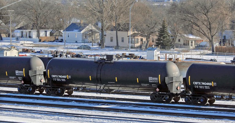 The National Transportation Safety Board onThursday Jan. 23, 2014 asked for stricter safety measures for transporting crude oil by rail. One proposal by the NTSB would call for railroads to have careful route plannng for trains with hazardous materials and to avoid  populated areas. Above, a line of tanker cars used to carry crude oil in the Mandan railyard on Thursday afternoon. (AP Photo/The Bismarck Tribune, Tom Stromme)