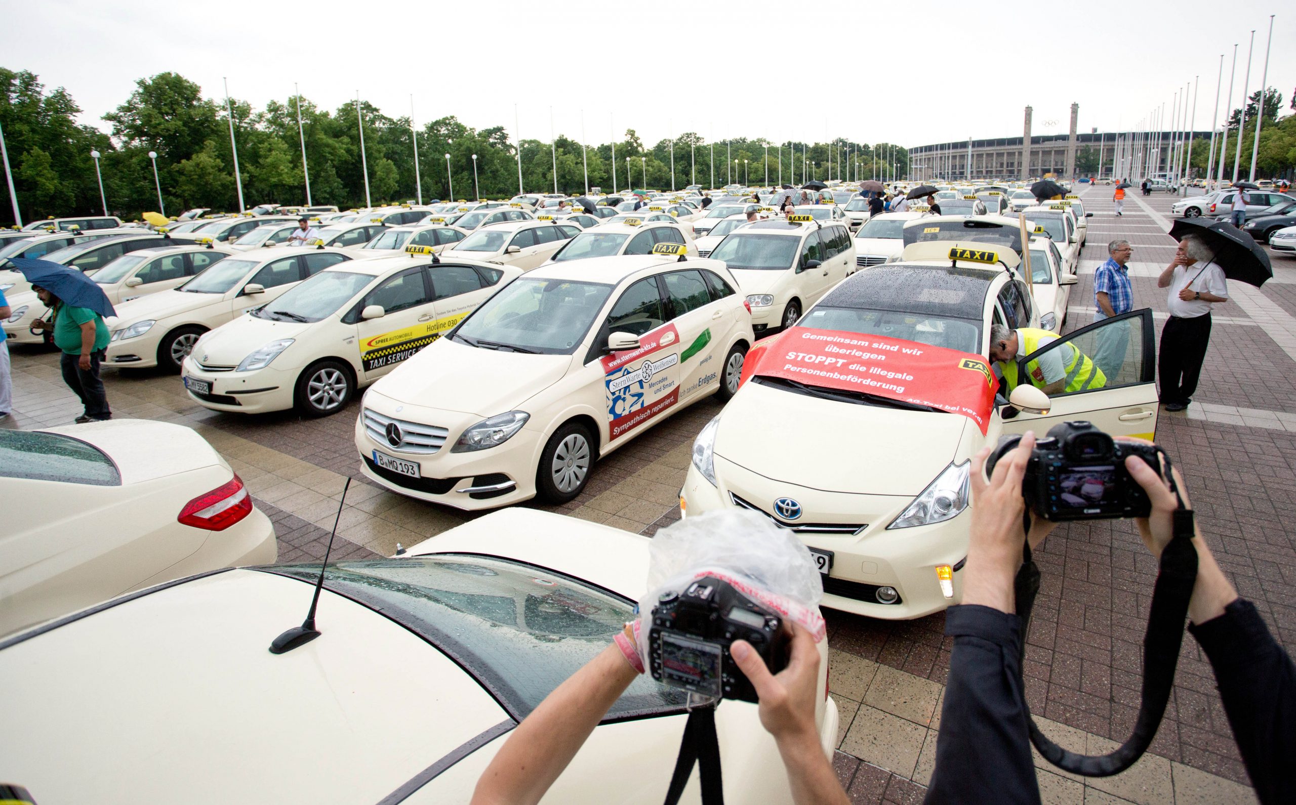 Berlin taxi drivers hail city’s Uber ban