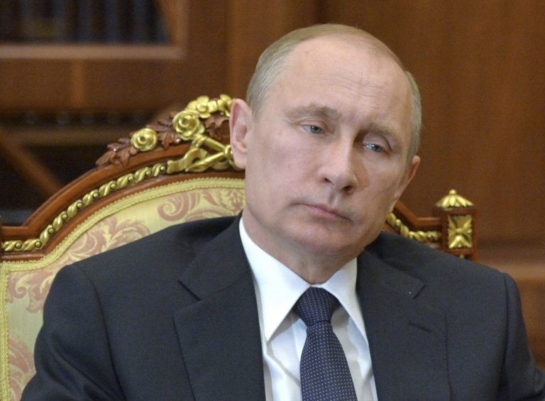 In this Image supplied by the Presidential Press Service Russian President Vladimir Putin meets with the regional leader of Karelia in the Kremlin in Moscow, Russia, Wednesday, March 11, 2015. (AP Photo/RIA-Novosti, Alexei Druzhinin, Presidential Press Service)