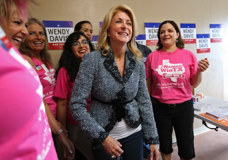 Texas state Sen. Wendy Davis poses with members of Planned Parenthood in San Antonio, Texas, on Monday. (AP/Jerry Lara)