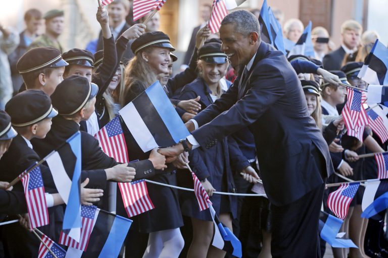 U.S. President Barack Obama greets children as he is welcomed by Estonian President Toomas Hendrik Ilves at Kadriorg Palace in Tallinn, Estonia, Wednesday, Sept. 3, 2014. Obama is in Estonia for a one day visit where he will meet with Baltic State leaders before heading to the NATO Summit in Wales. (AP Photo/Charles Dharapak)
