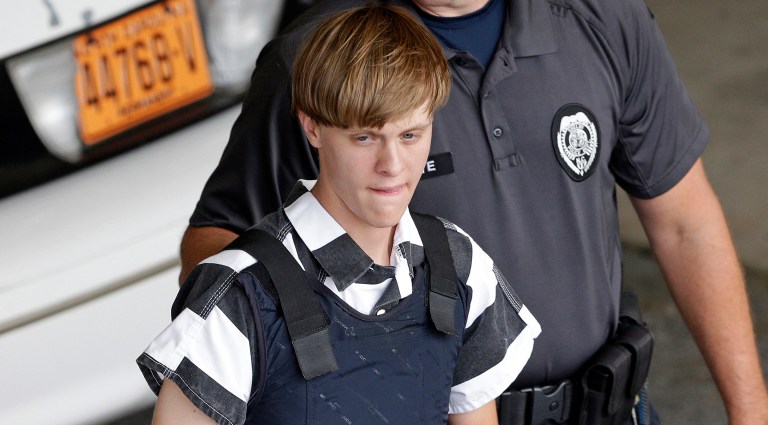 In this June 18, 2015 file photo, Charleston, S.C., shooting suspect Dylann Storm Roof is escorted from the Cleveland County Courthouse in Shelby, N.C. (AP Photo/Chuck Burton, File)
