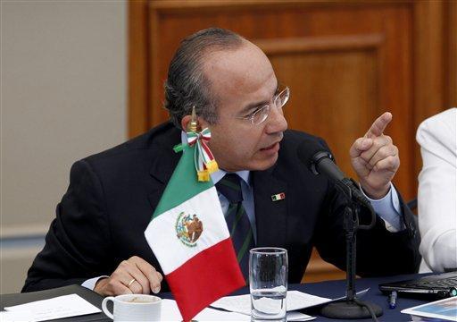Mexico's President Felipe Calderon, gestures during a meeting with victims of violence in Mexico City, Thursday June 23, 2011. Calderon says he doesn't regret his strategy to fight organized crime, despite calls to end a confrontation that has killed at least 35,000 during his administration. (AP Photo/Eduardo Verdugo)