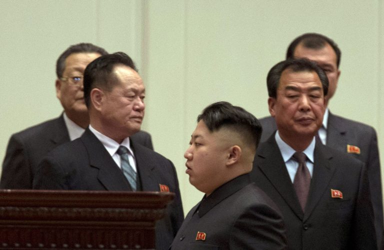   North Korean leader Kim Jong Un, center, leaves after attending a national meeting of top party and military officials on the eve of the first anniversary of the death of his late father Kim Jong Il in Pyongyang, North Korea, Sunday, Dec. 16, 2012. (AP Photo/Ng Han Guan)  