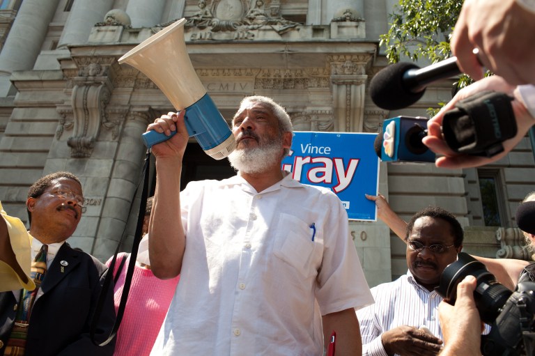 The Rev. Graylan Hagler speaks out Wednesday in support of Mayor Vincent Gray outside the Wilson building in Washington. (Graeme Jennings/Examiner)
