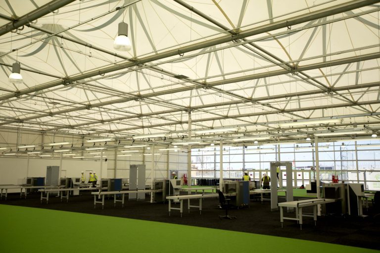   FILE - This file picture dated Friday, May 25, 2012 shows a general view of the interior of the Games Terminal for the Olympics at Heathrow Airport in London. The UK Border Force has promised to put on more staff during peak days leading to the Olympics, which take place from July 27-Aug. 12. They promise that they've planned _ taking account of how many people are coming and when _ and that all desks will be staffed during peak periods from mid-July to early August. (AP Photo/Matt Dunham, file)  