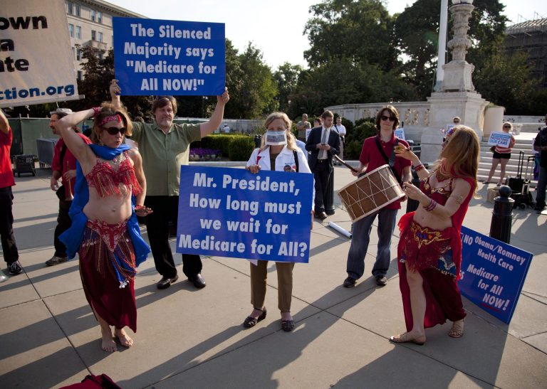A group of belly dancers in favor of Medicare for all perform outside the Supreme Court in Washington, Thursday, June 28, 2012, before a landmark decision on health care.  (AP Photo/Evan Vucci)