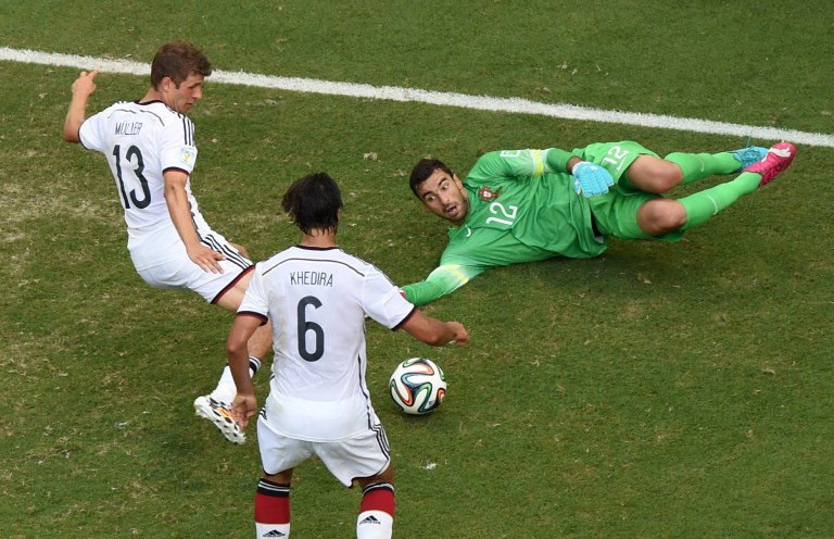 Germany's Thomas Mueller, left, scores his side's 4th goal during the group G World Cup soccer match between Germany and Portugal at the Arena Fonte Nova in Salvador, Brazil, Monday, June 16, 2014.  (AP Photo/Francois Marit, pool)