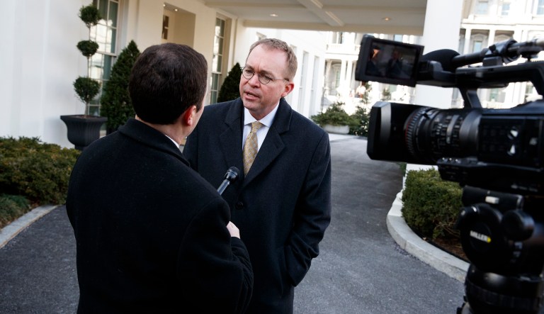 OMB Director Mick Mulvaney speaks with reporters outside the White House about a possible government shutdown. Mulvaney said the White House now sees the chances of the government shutting down as 