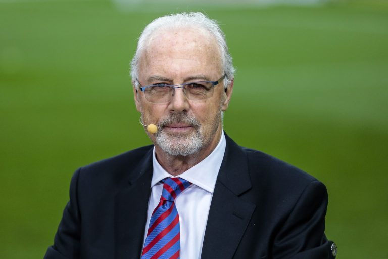 FILE - The May 17, 2014 photo shows German soccer legend Franz Beckenbauer attends a television show prior to the German Soccer Cup Final between FC Bayern Munich and Borussia Dortmund at the Olympic Stadium Berlin. Beckenbauer has been banned from football duty for 90 days for snubbing an investigation into Qatar's 2022 World Cup bid. FIFA said Friday, June 13, 2014 the 90-day provisional ban was requested by ethics prosecutor Michael Garcia. Beckenbauer was a voting member of FIFA's executive committee in December 2010 when it chose Qatar, and Russia as 2018 World Cup host.  (AP Photo/Markus Schreiber)