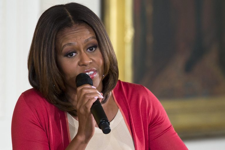 Michelle Obama is rearranging plans for a speech before graduating high school seniors in Kansas in the face of protests that her appearance at a combined graduation ceremony for five schools would limit seating for families and friends. (AP image)