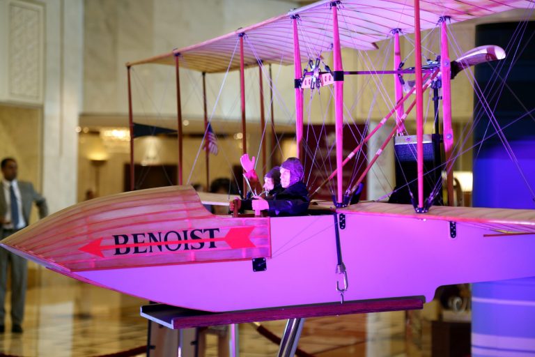 A model of the aircraft that made the historic trip a century ago is on display at the 70th International Air Transport Association (IATA) in Doha, Qatar, Monday, June 2, 2014. The aviation industry is marking 100 years since the first scheduled commercial flight took off, making a 23-minute journey across Florida's Tampa Bay. (AP Photo/Osama Faisal)