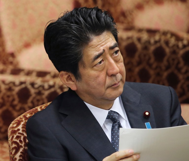 FILE - Int his Thursday, May 29, 2014 file photo, Japanese Prime Minister Shinzo Abe attends the Upper house diplomacy and Defense committee session in Tokyo. Japan and North Korea appear to be on the verge of a breakthrough on a bizarre legacy of the Cold War, a secret, government-ordered program that led to the abduction of more than a dozen and possibly several hundred Japanese citizens in the 1970s and 80s by North Korean infiltrators and spies. (AP Photo/Koji Sasahara, File)