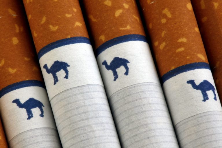 FILE - In this Oct. 21, 2009 file photo, Camel cigarettes, a Reynolds American brand, are shown in Philadelphia. Reynolds American reports quarterly earnings on Tuesday, Feb. 11, 2014. (AP Photo/Matt Rourke, File)