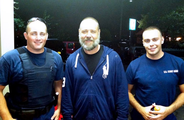 A photo provided by the U.S. Coast Guard  shows Russell Crowe, center, with Coast Guard petty officers  Robert Swieciki, left,  and Thomas Watson Sunday  Sept. 2, 2012.  Crowe and a friend became disoriented while kayaking in Long Island Sound Sunday and called the Coast Guard for assistance.  (AP Photo/U.S. Coast Guard)