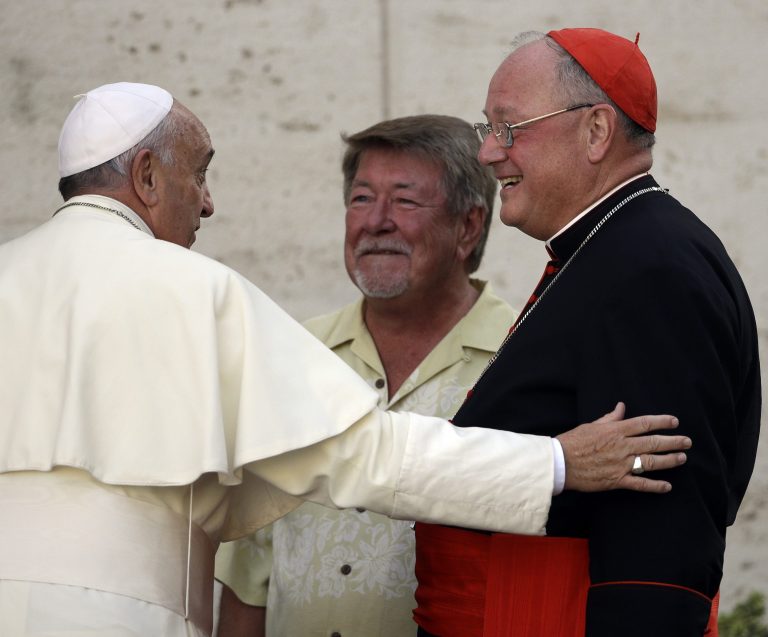 Pope Francis talks with New York Cardinal Timothy Dolan as he  arrives for an afternoon session of a two-week synod on family issues at the Vatican, Thursday, Oct. 9, 2014. (AP Photo/Gregorio Borgia)