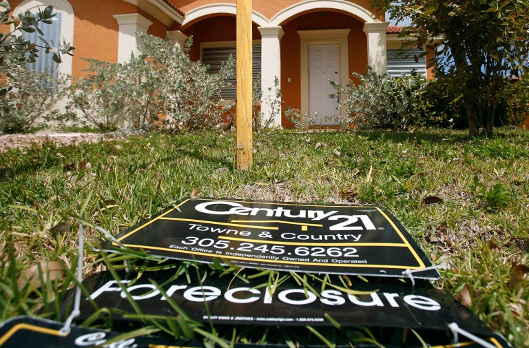In this March 24, 2009 file photo, a sign lies on the ground in front of a foreclosed home in Homestead, Fla. In Bank of America Corp. v. City of Miami, the city complained that banks during the subprime crisis intentionally lent to minority ethnicity borrowers using riskier loans that led to foreclosures and vacancies. (AP Photo/J Pat Carter, File)