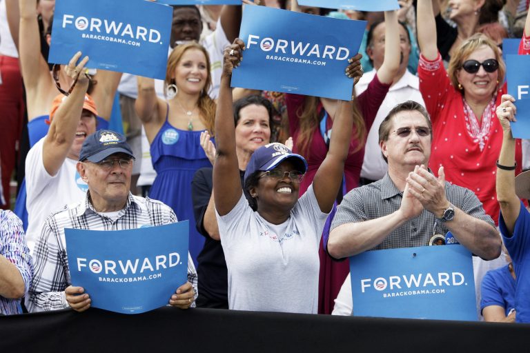 Spectators cheer as President Barack Obama addresses the crowd at a rally at St. Petersburg College's Seminole Campus on Saturday, Sept. 8, 2012 in St Petersburg, Fla. (AP Photo/The Tampa Bay Times, Will Vragovic)  TAMPA OUT; CITRUS COUNTY OUT; PORT CHARLOTTE OUT; BROOKSVILLE HERNANDO TODAY OUT