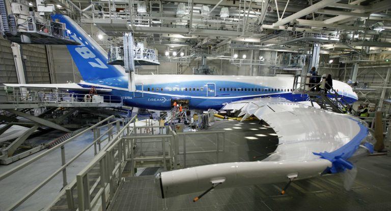 File- This April 30, 2009 file photo shows a Boeing 787, painted in the company's colors, stands in the paint hangar at the company's facility in Everett, Wash. Boeing's much-delayed 787 Dreamliner has hit another production snafu. Hairline cracks have been discovered in the wings of some 787's that are being built. The Chicago-based manufacturer said none of the 122 jets already flown by airlines around the world are affected. (AP Photo/Elaine Thompson, File)
